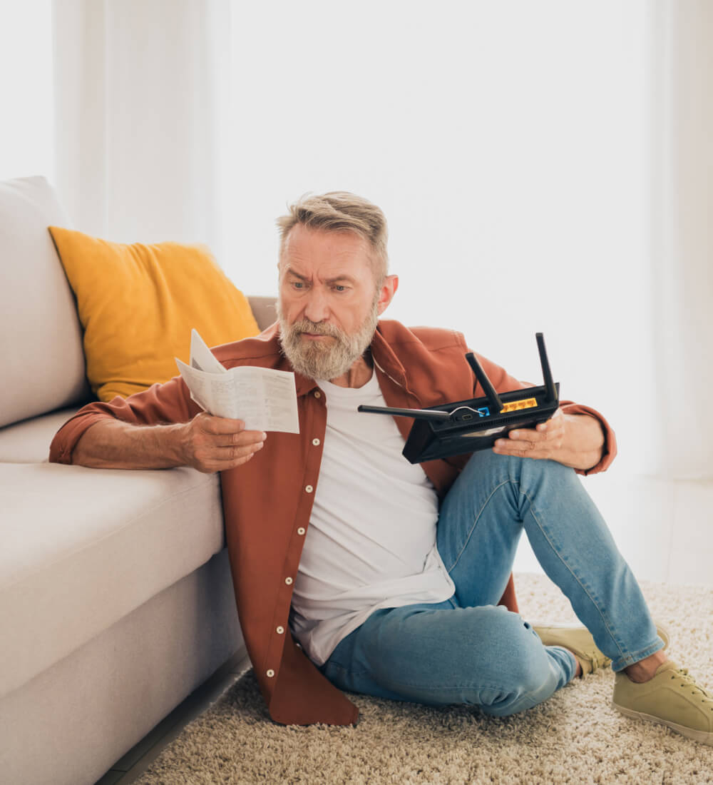 Senior setting up a 5G home internet gateway at home