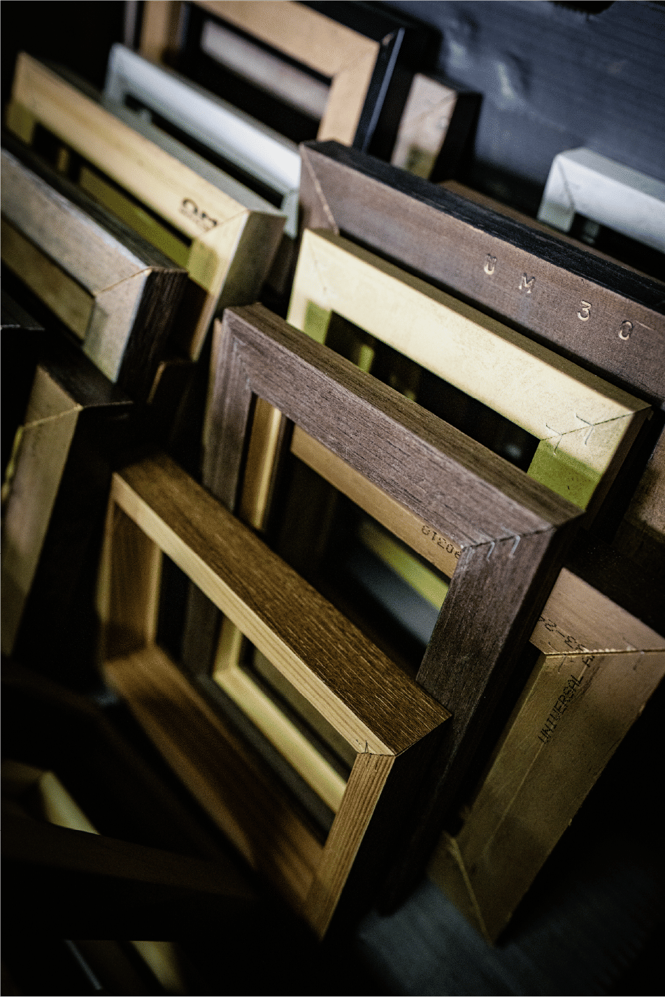 Assorted wooden frames stacked showcasing craftsmanship