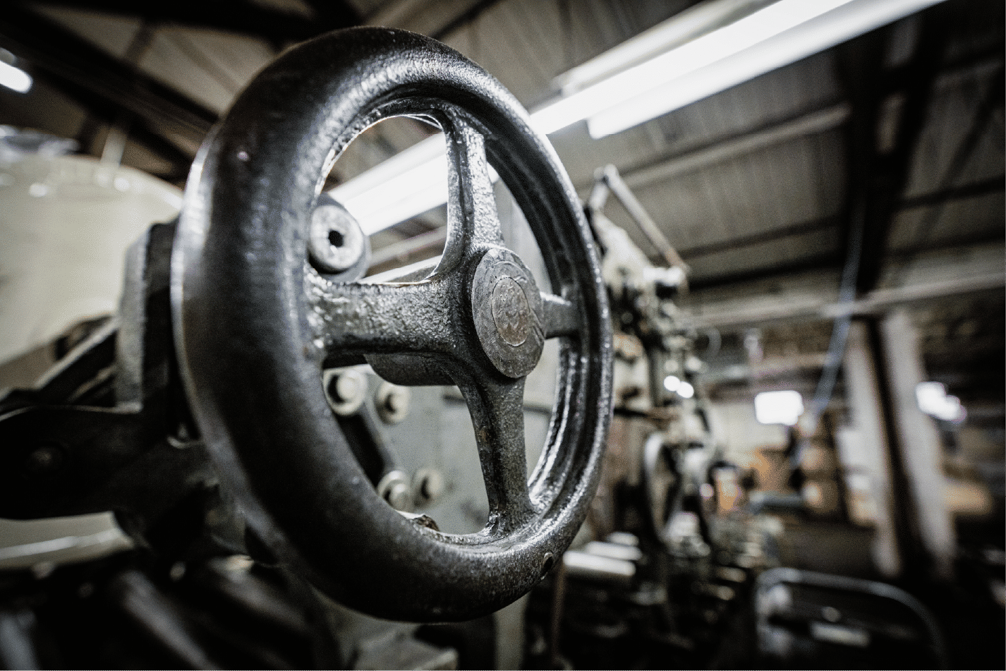 Close-up industrial machine wheel in workshop