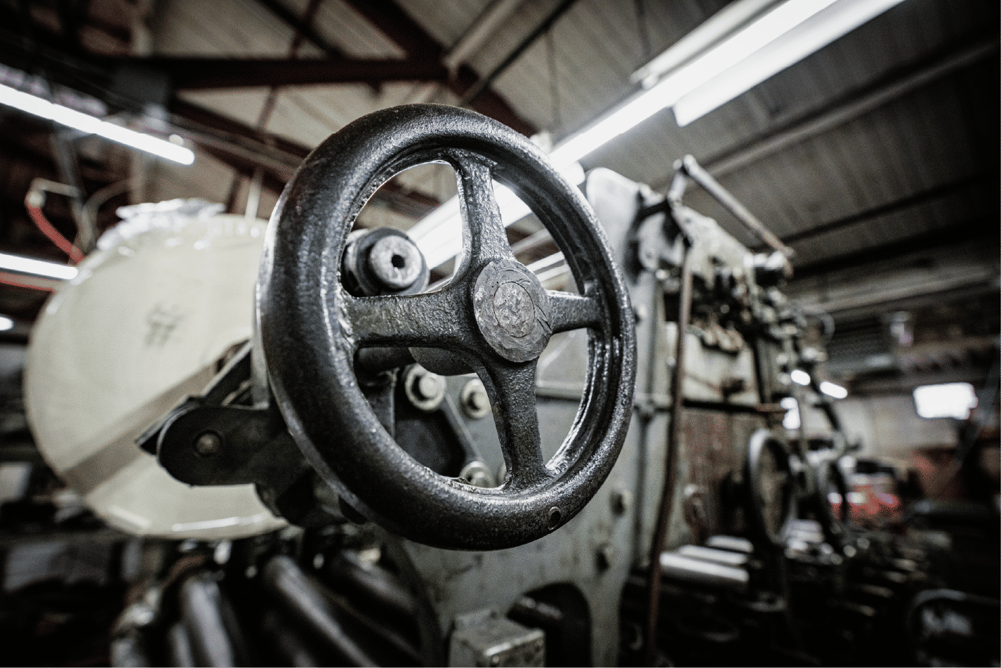 Metal handwheel on heavy machinery in factory