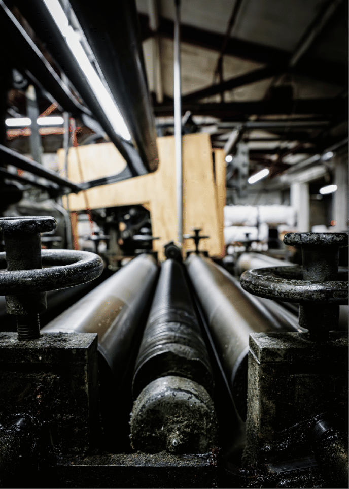 Industrial rollers and controls in manufacturing facility