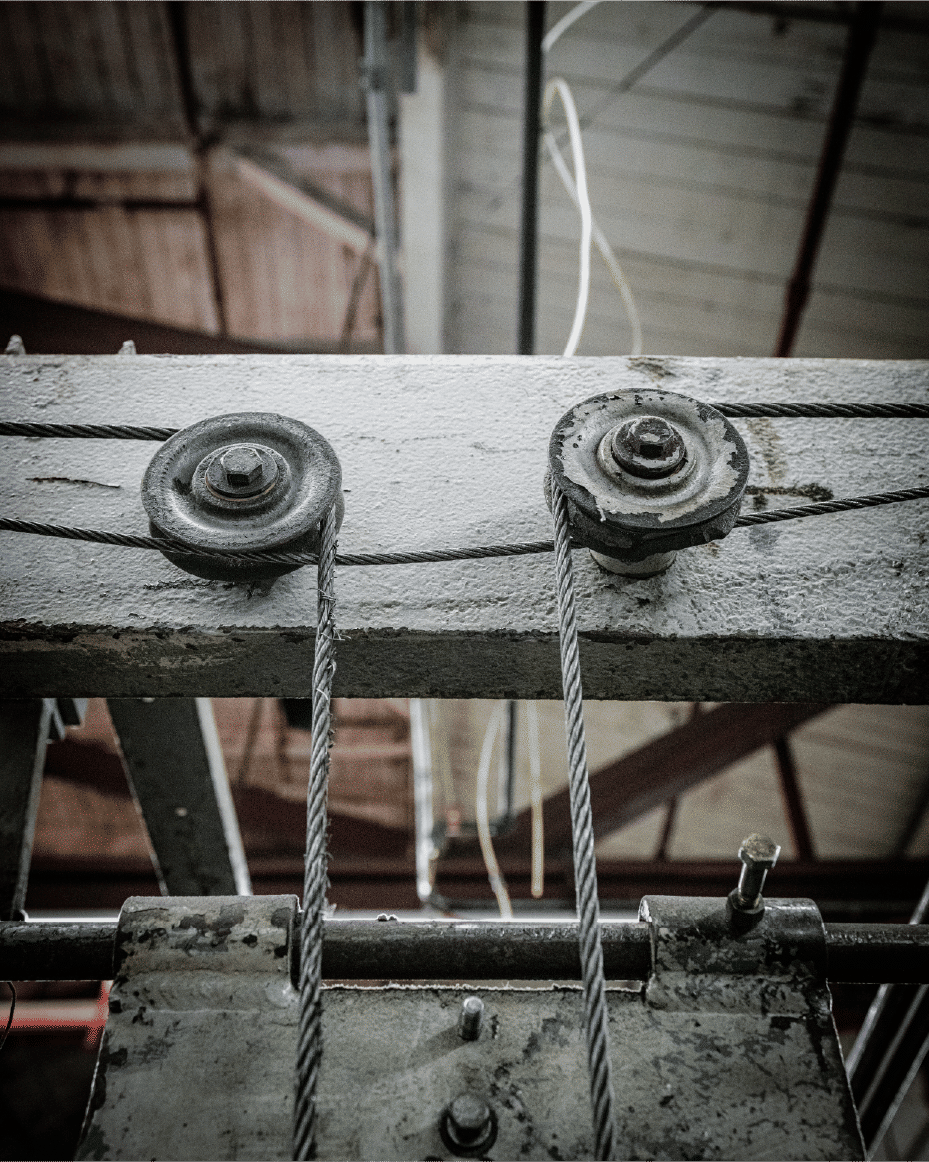 Overhead cables and pulleys on industrial equipment