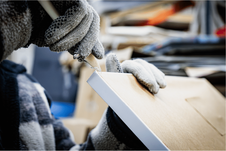 Worker securing frame in workshop