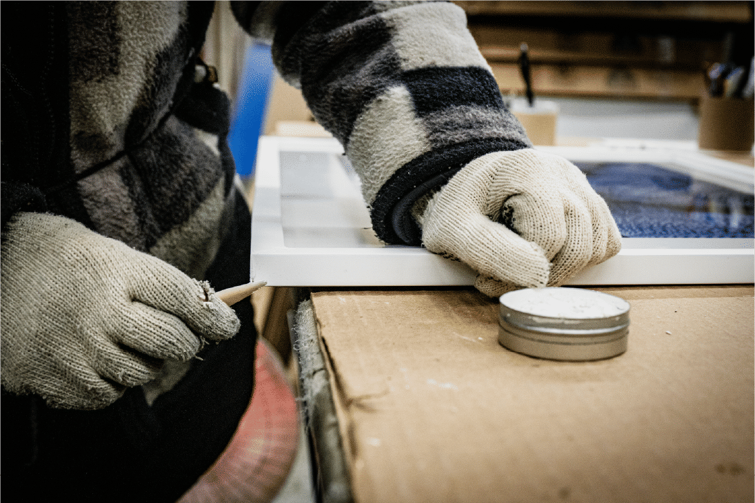 Close-up of cutting head moving across sheet surface
