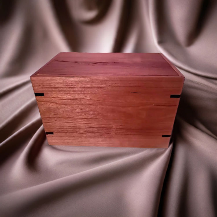 Front and top view of  Biodegradable Cherry Urn , showcasing its design and customizable engraving area