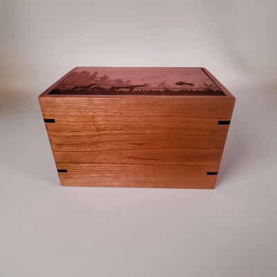Front and top view of Cherry Forest Scene Memorial Urn with detailed bird dog engraving.