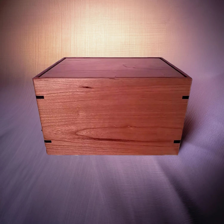 Front and top view of  Handcrafted Cherry Tribute Urn , showcasing its design and customizable engraving area
