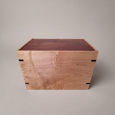 Front and top view of Walnut and Maple Eternal Urn, showcasing its design and customizable engraving area