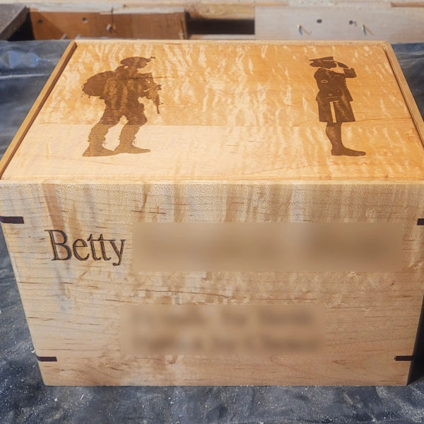 handcrafted curly maple cremation urn with custom laser engraved military tribute