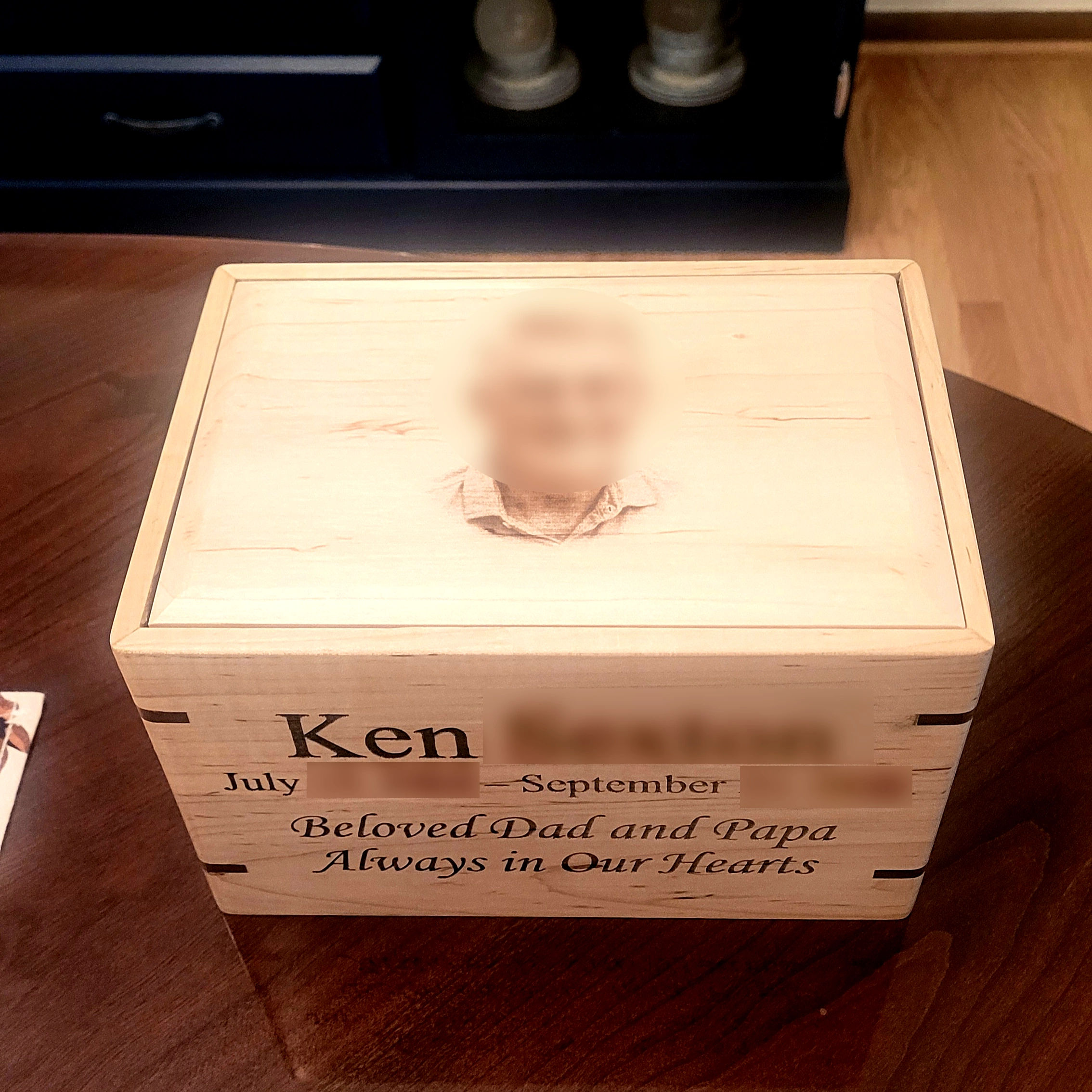 handcrafted maple hardwood cremation urn with walnut splines, a laser-engraved portrait on the lid and a custom inscription on the front