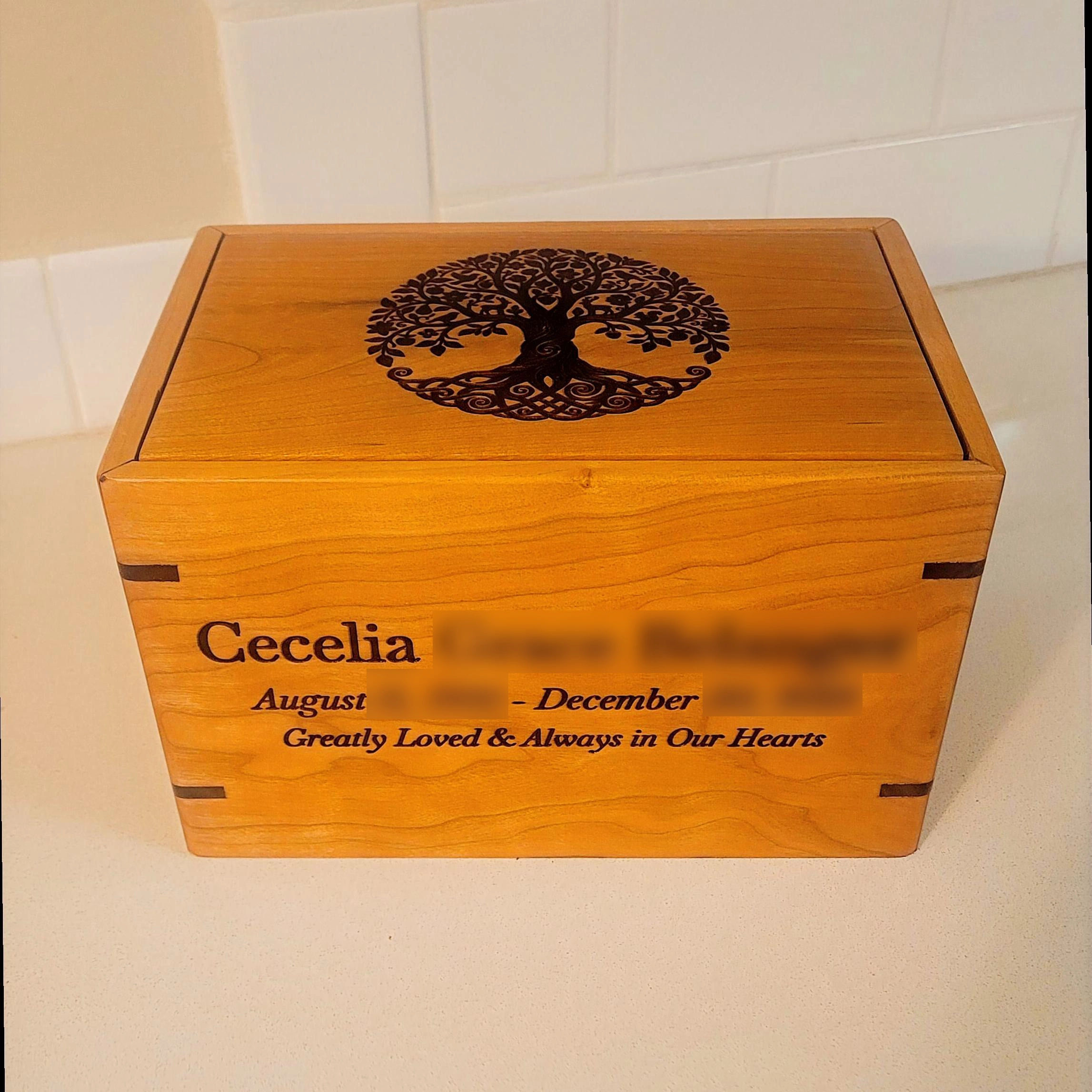 handcrafted cherry hardwood cremation urn with custom laser engraving