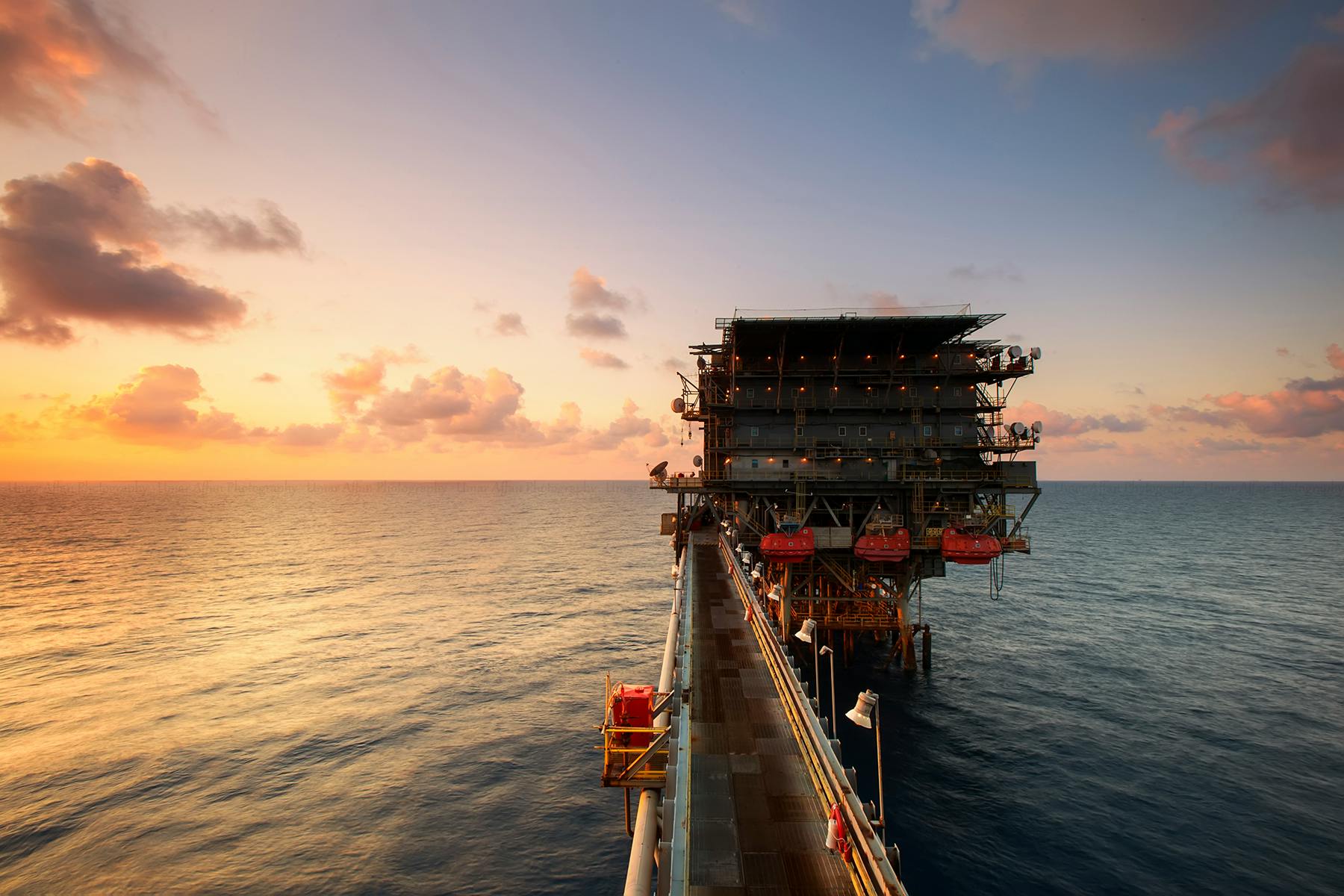 Offshore mining platform at sunset