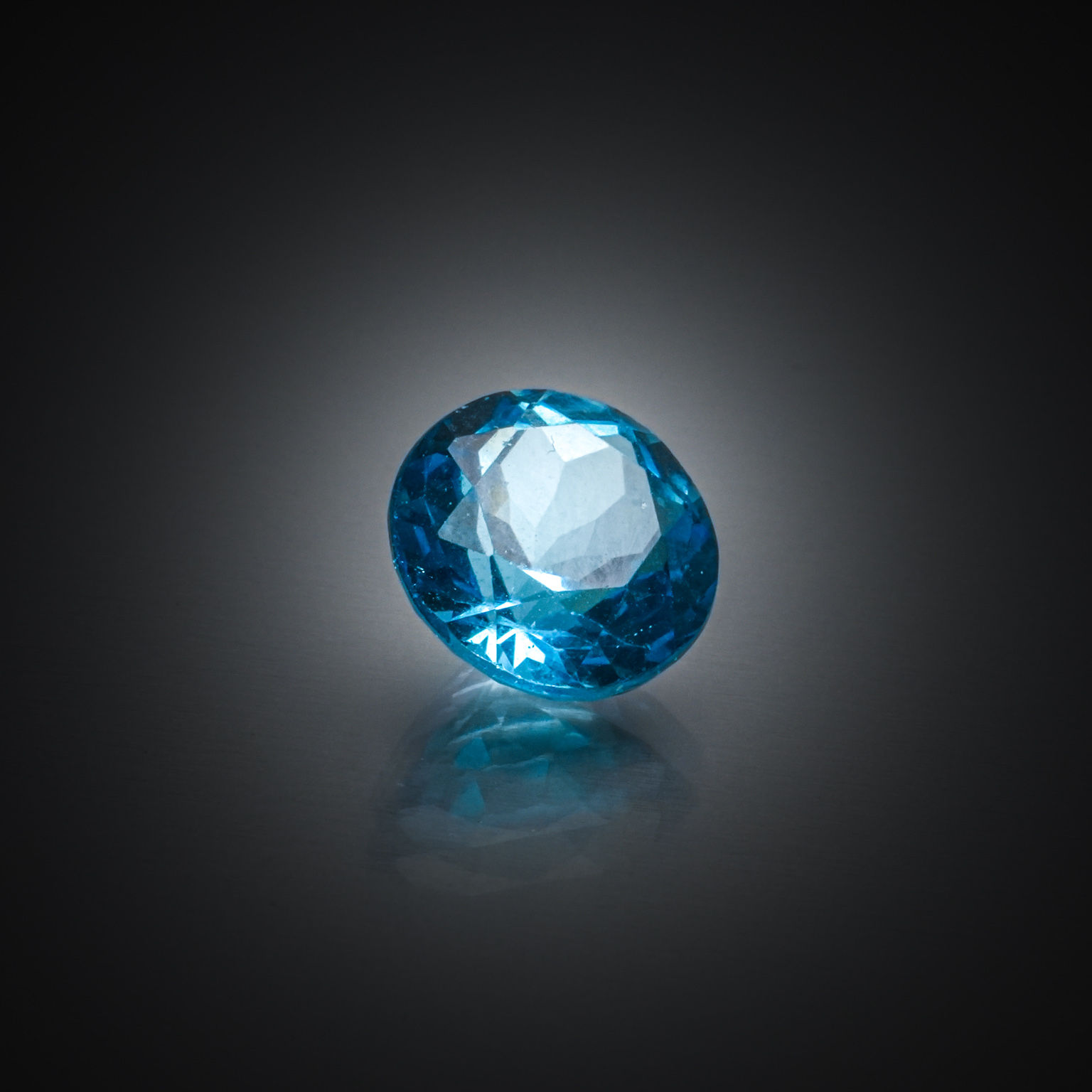 Quartz œil de tigre rond cabochon sur papier. - Lazuli