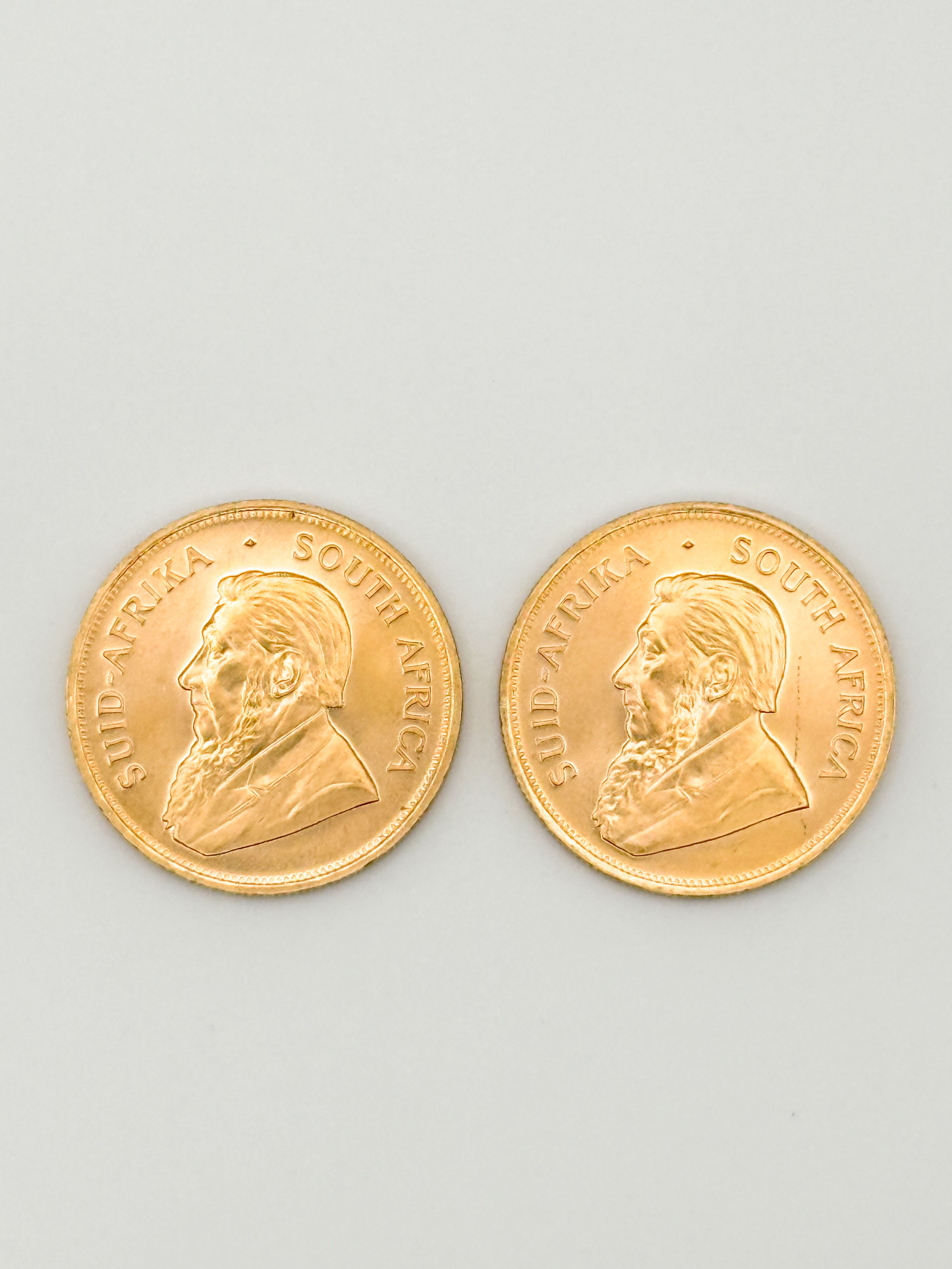 Lot de deux pièces en or de 1 oz kruggerand (1982 x 2). - Lazuli