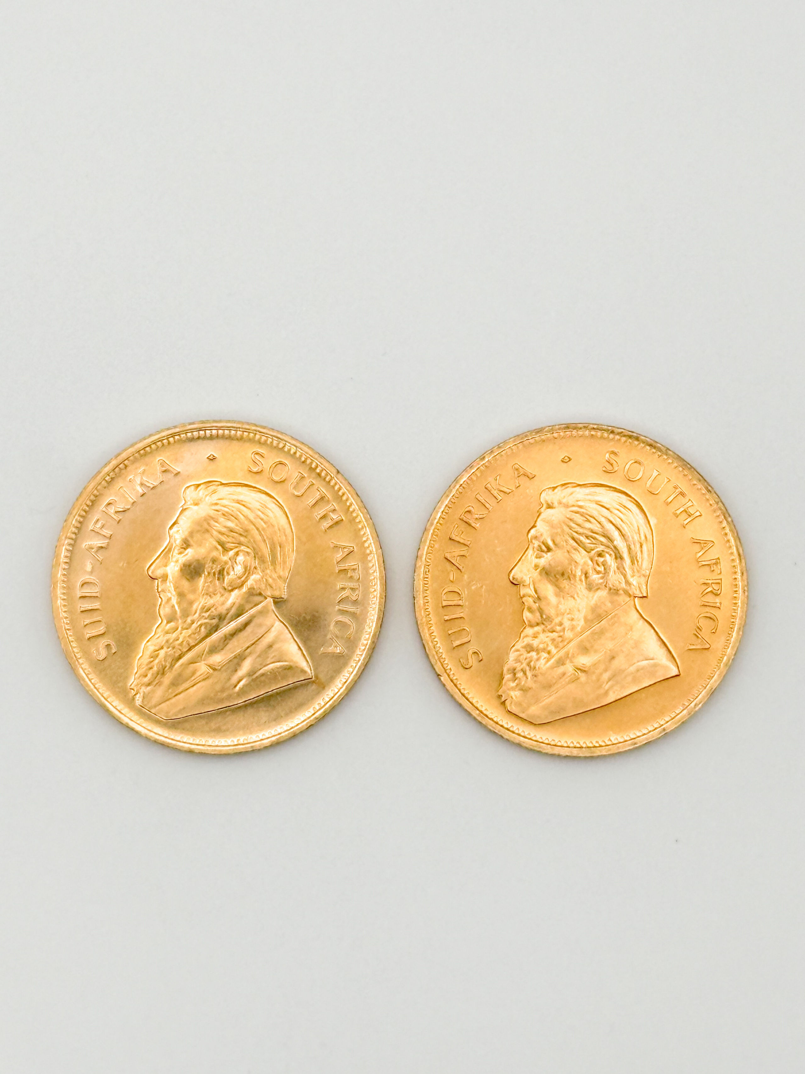 Lot de deux pièces en or de 1 oz kruggerand (1980 x 2). - Lazuli