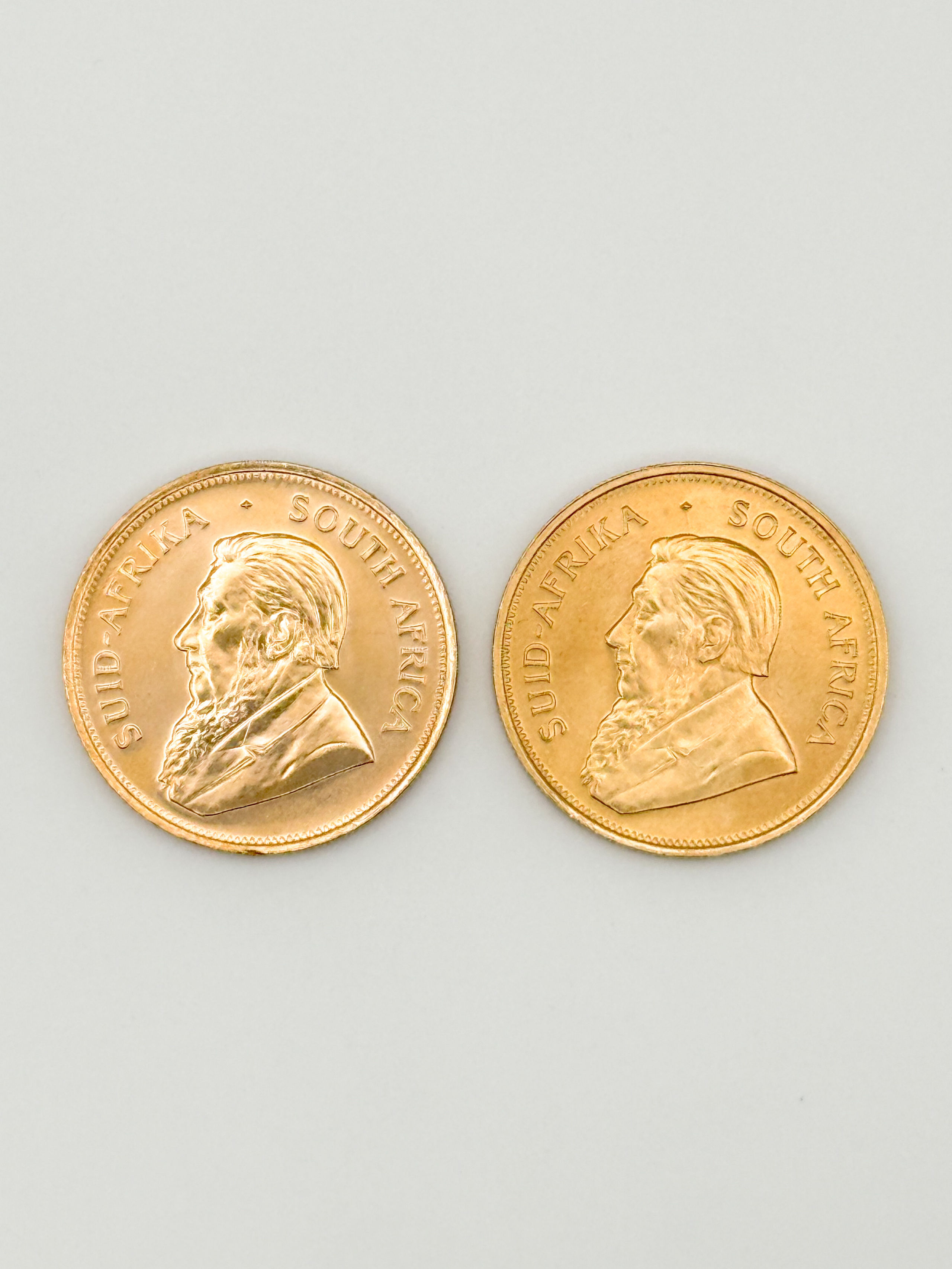 Lot de deux pièces en or de 1 oz kruggerand (1975 x 2). - Lazuli