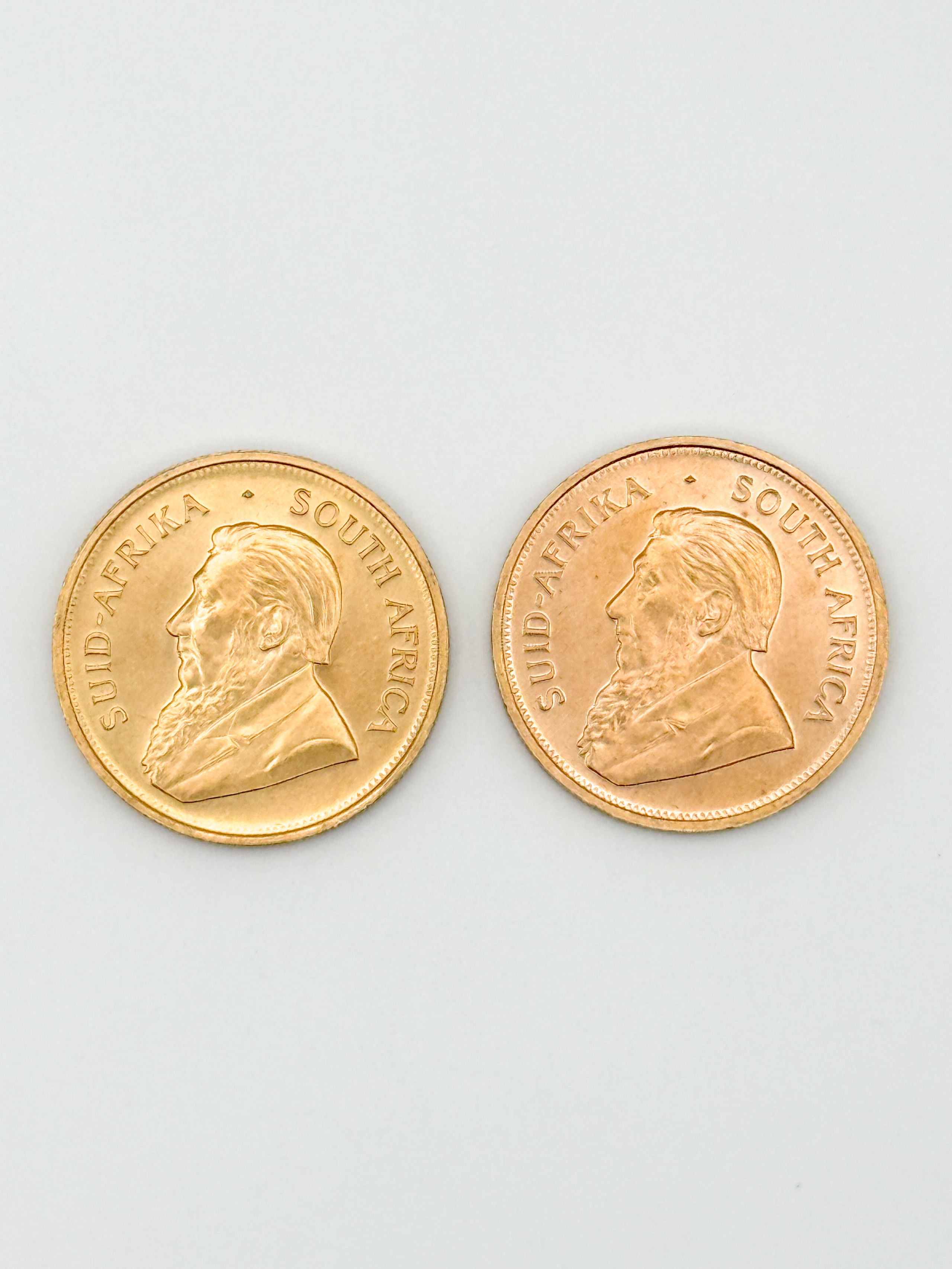Lot de deux pièces en or de 1 oz kruggerand (1974 x 2). - Lazuli