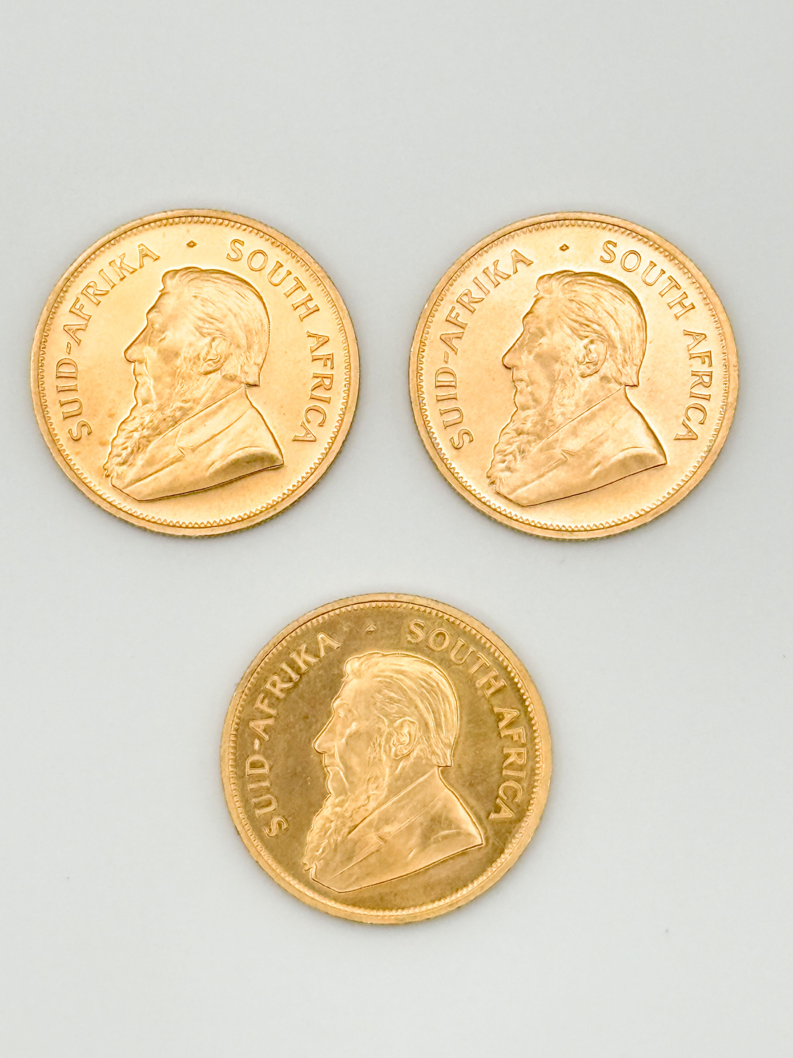 Lot de trois pièces en or de 1 oz kruggerand (1979 x 3). - Lazuli
