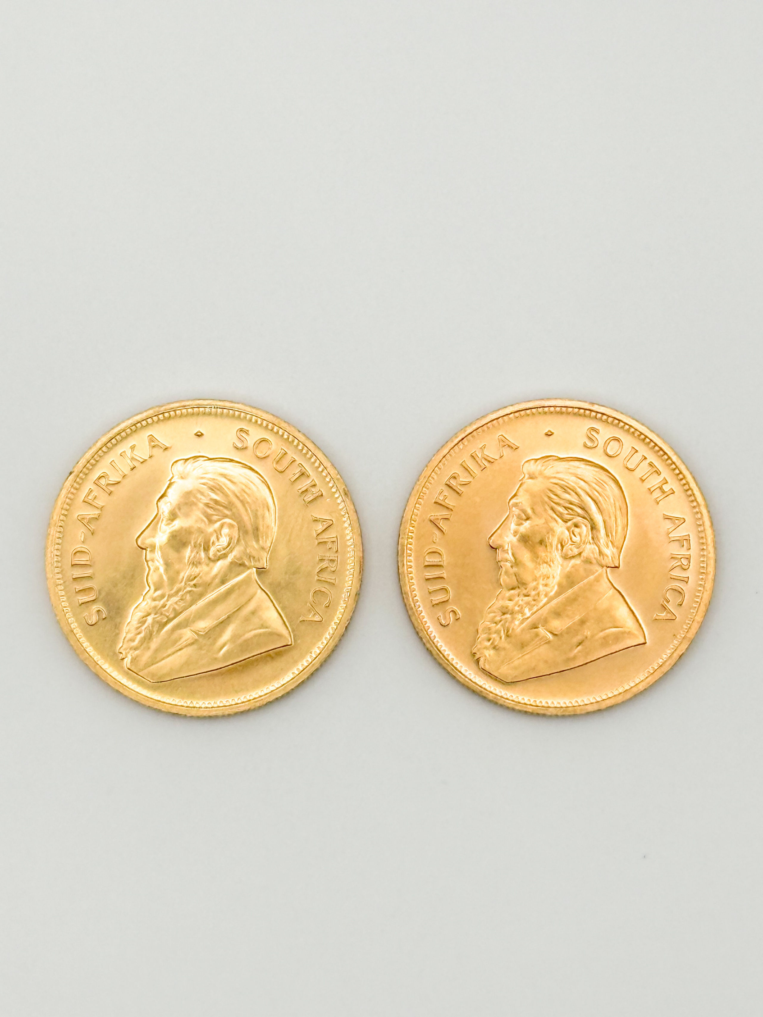 Lot de deux pièces en or de 1 oz kruggerand (1981 x 2). - Lazuli