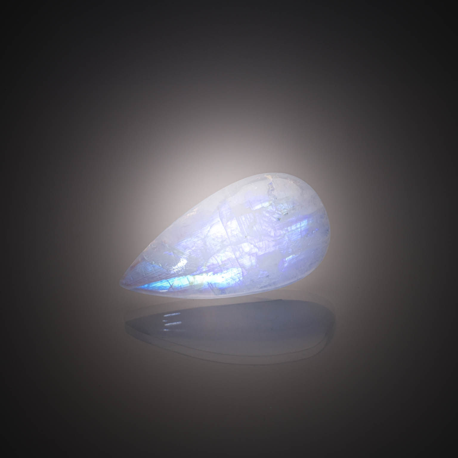 Agate multicolore ovale cabochon sur papier. - Lazuli