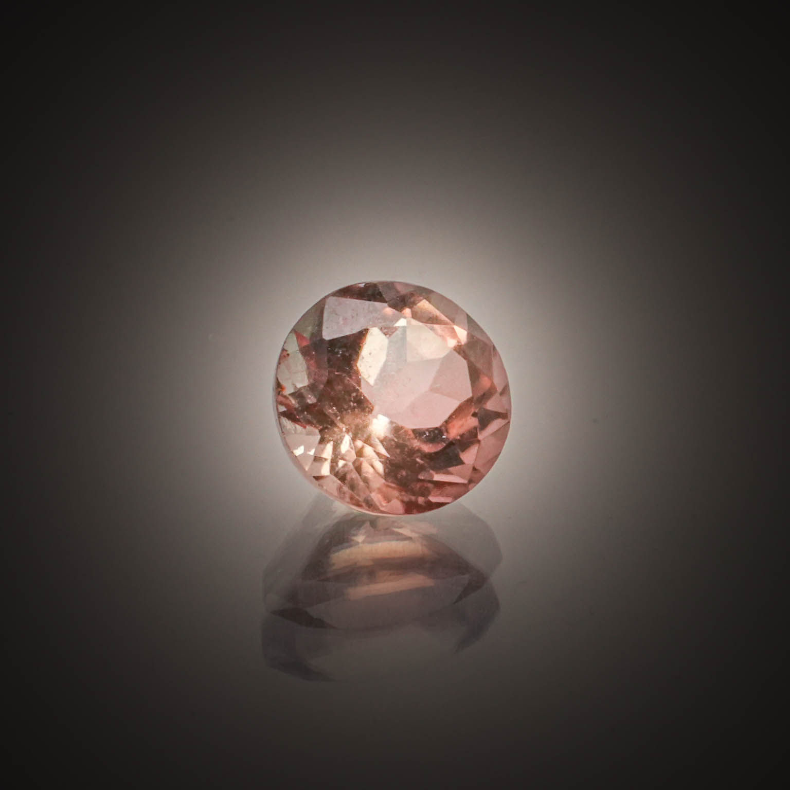 Tourmaline rose/orange ronde sur papier. - Lazuli