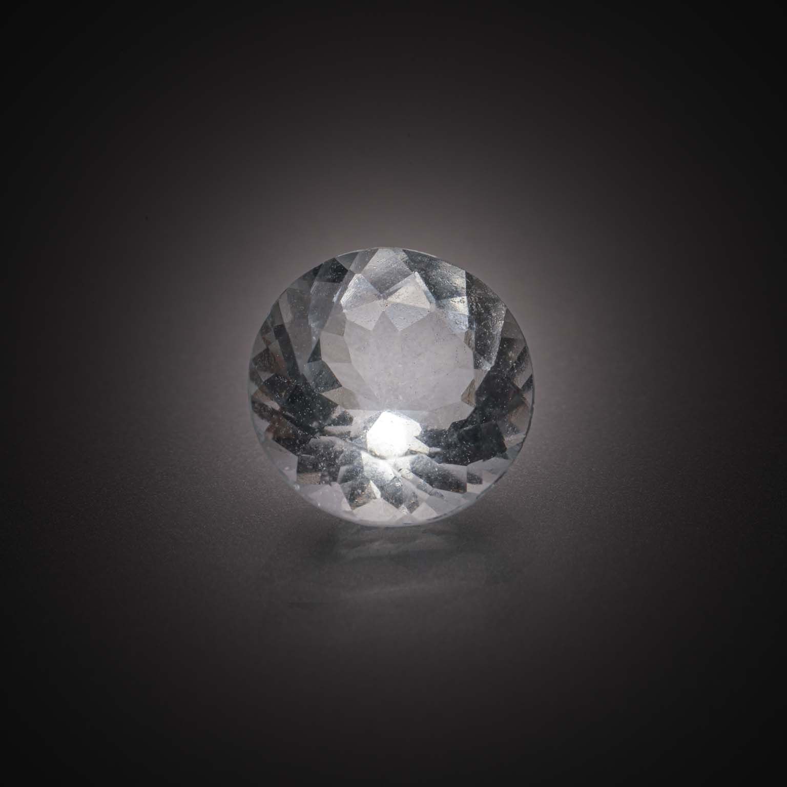 Aigue-marine ronde sur papier. - Lazuli