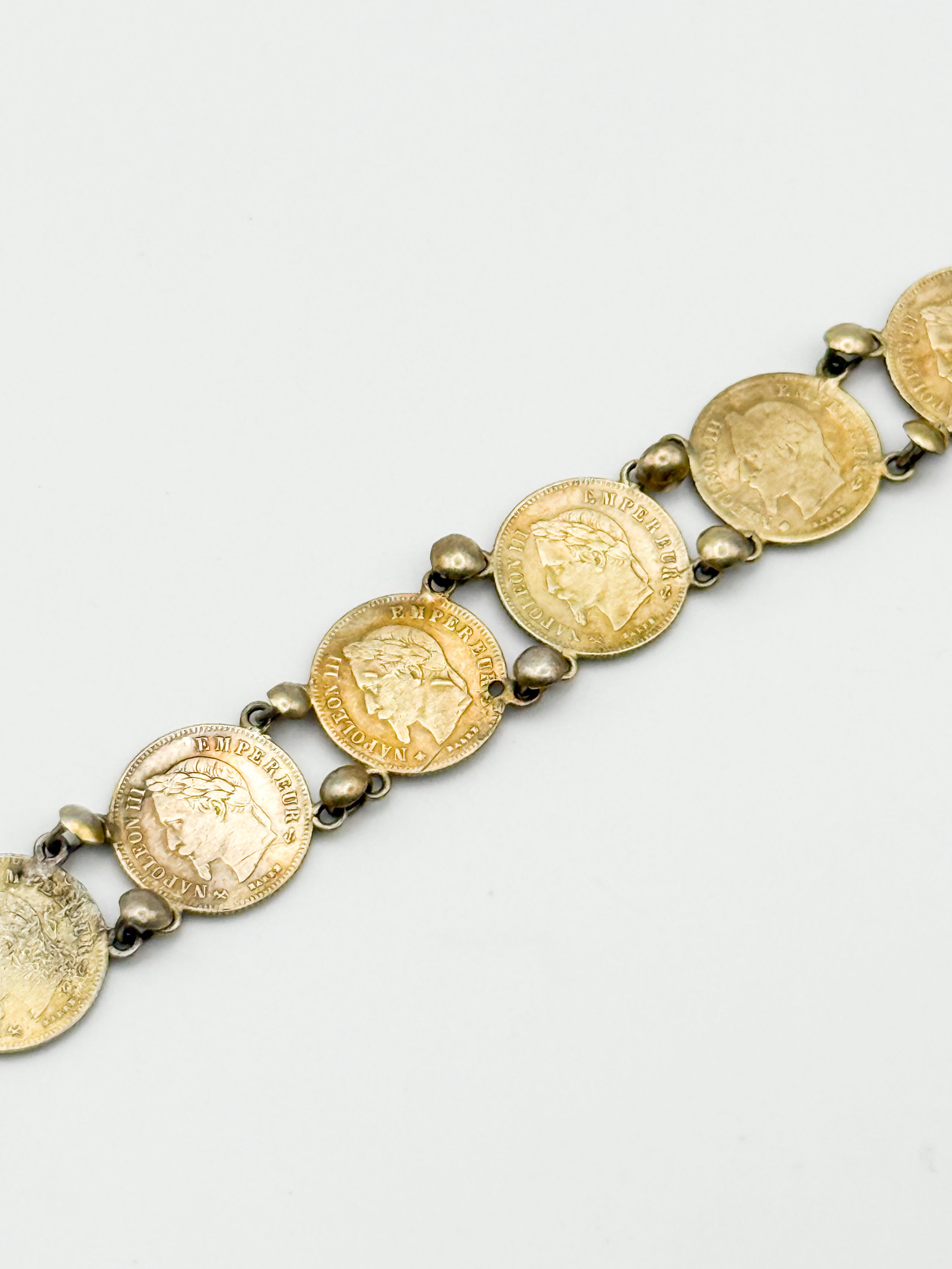 Bracelet en argent orné de 9 pièces de 20 cents Napoléon III tête laurée. - Lazuli
