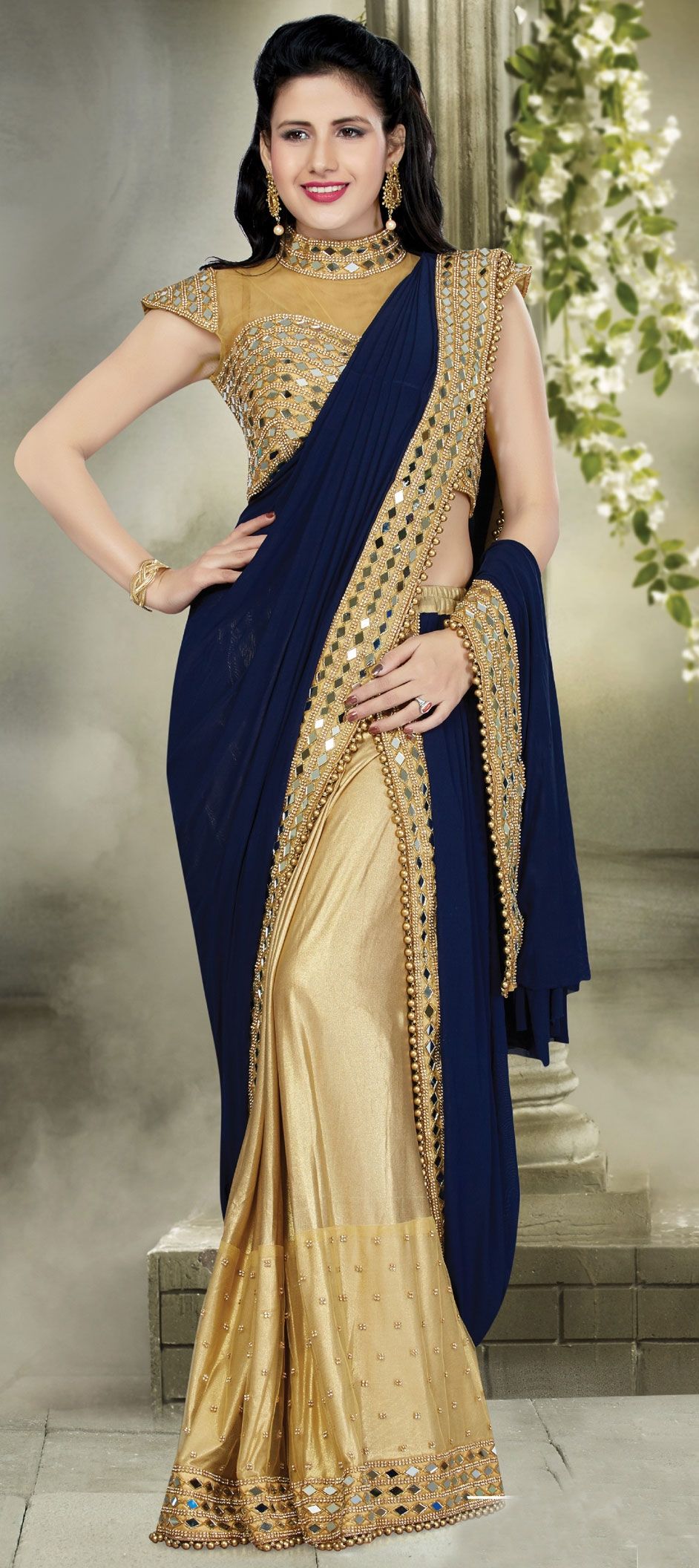 Esha Gupta is elegance personified in a beautiful blue silk saree