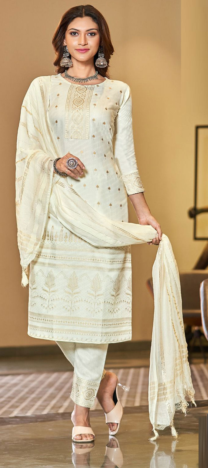 Off White Shimmer Silk Heavy mirror work PartyWear Salwar Suit with Cute Potli main image 1