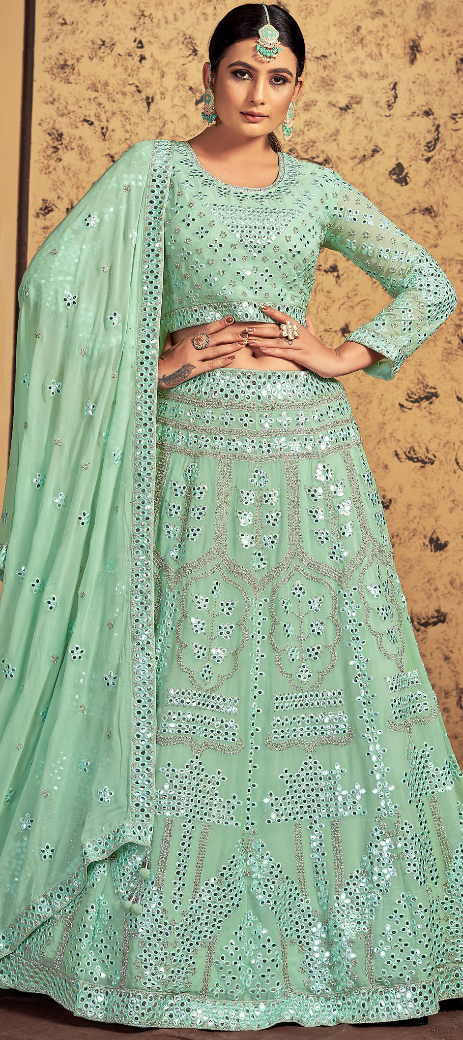 Excellent Net Fabric Sea Green Color Embroidered Work Lehenga