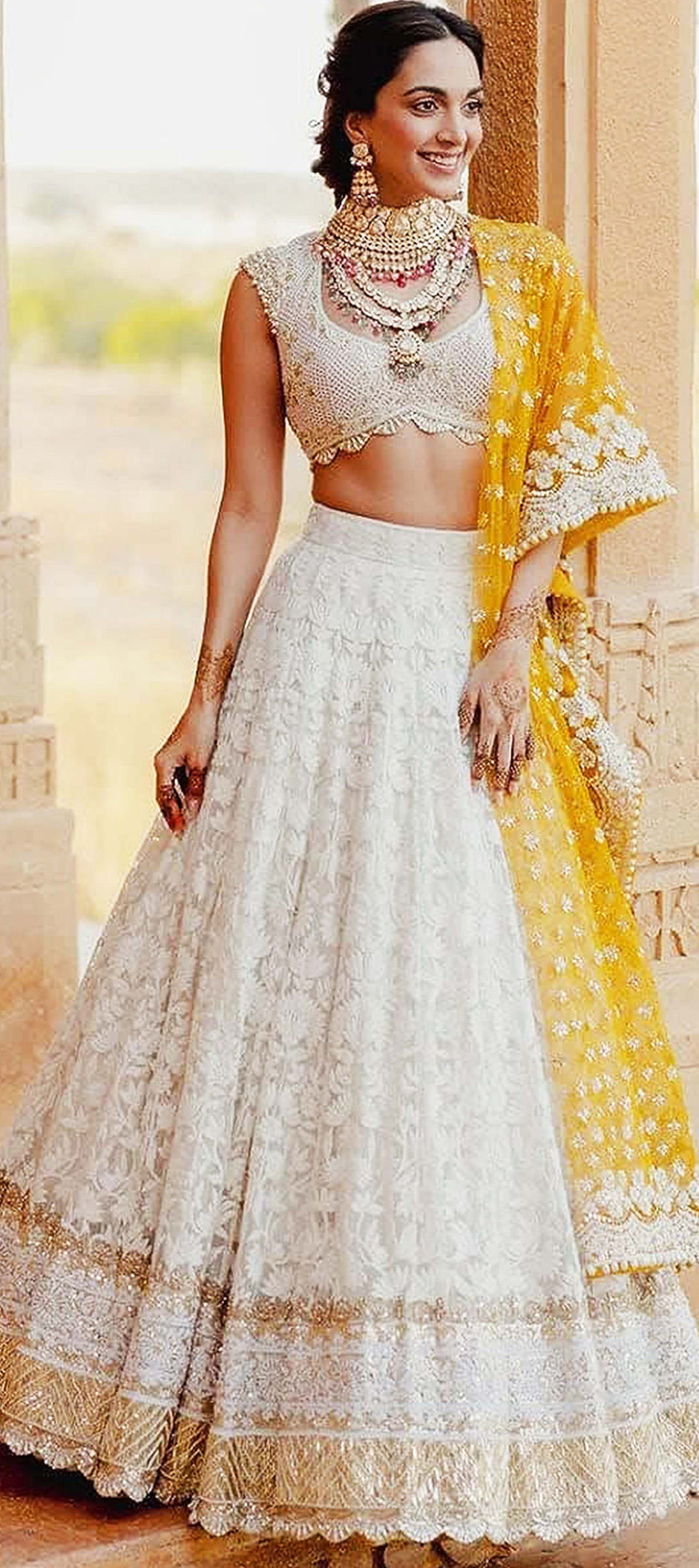 White Colored Heavy Sequence Work Net Lehenga - Rent