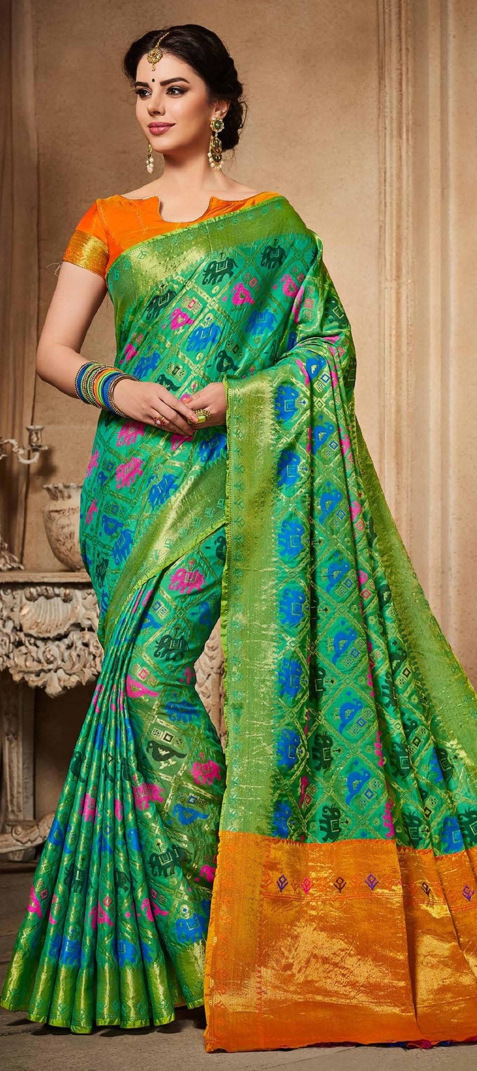 769799: Green color family Silk Sarees with matching unstitched blouse.