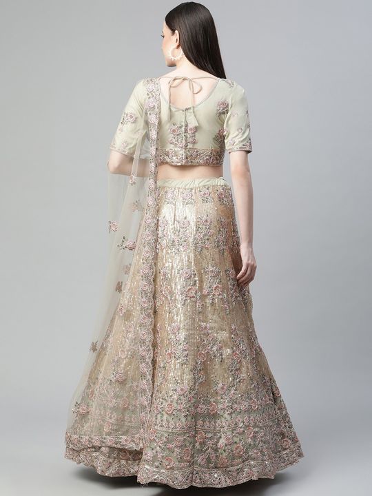 Mint green embellished lehenga set adorned with mirror and leather work;  paired with a tonal... | Designer lehnga choli, Indian wedding outfits, Raw  silk lehenga