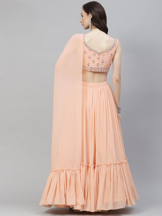 Peach net readymade lehenga with mirror & stone embroidered jaal design crop  top,3/4th collar shrug & floor-touch skirt