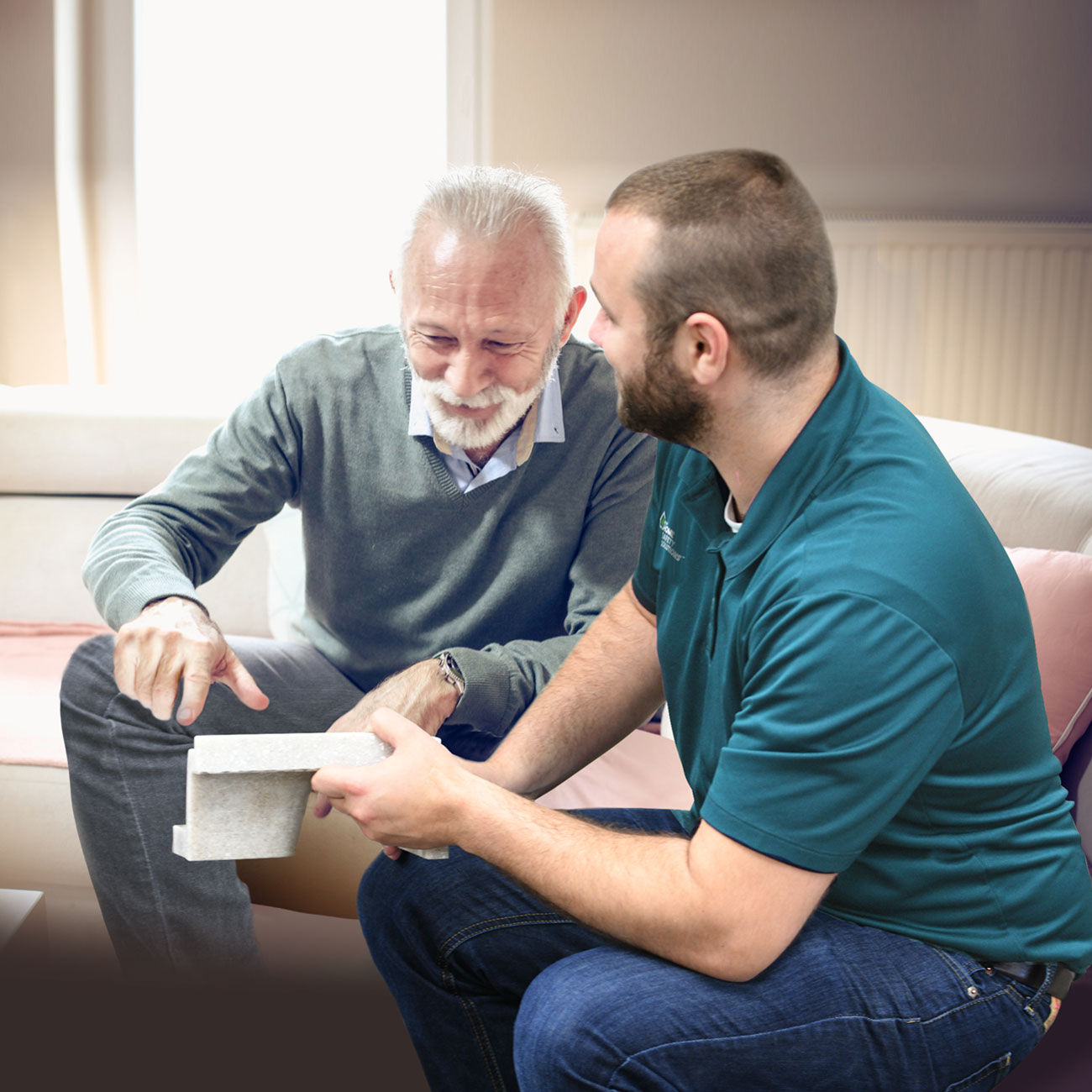 Leaf Home Safety Solutions employee demonstrates a product to a customer in their home