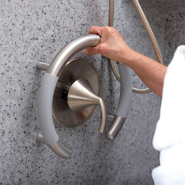 Image showing woman using circular safety handle surrounding shower knobs