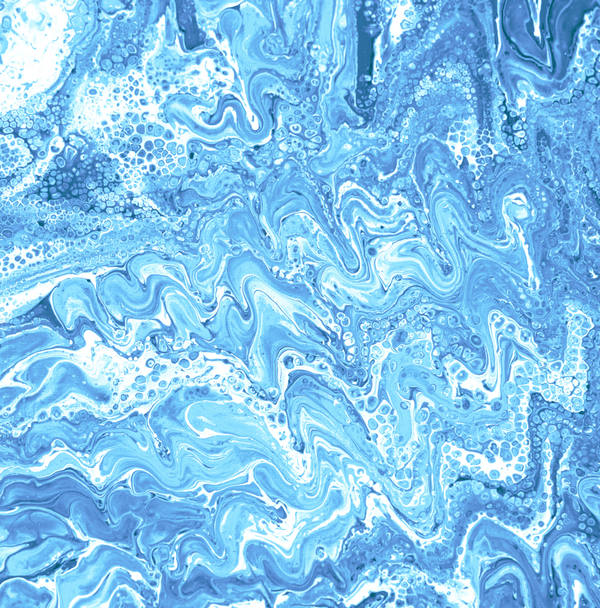 Acrylic pour of cobalt and sky blue rippling over white in fine parallel waves, foam-like cells at the top