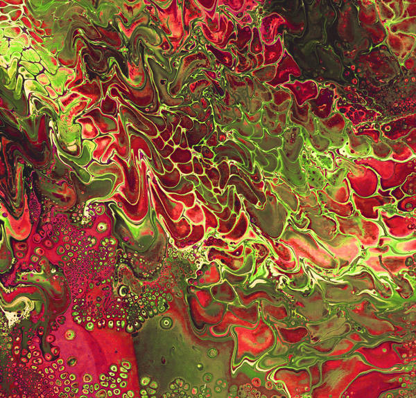Acrylic pour of scarlet and lime green splitting into feathered fronds over dark olive