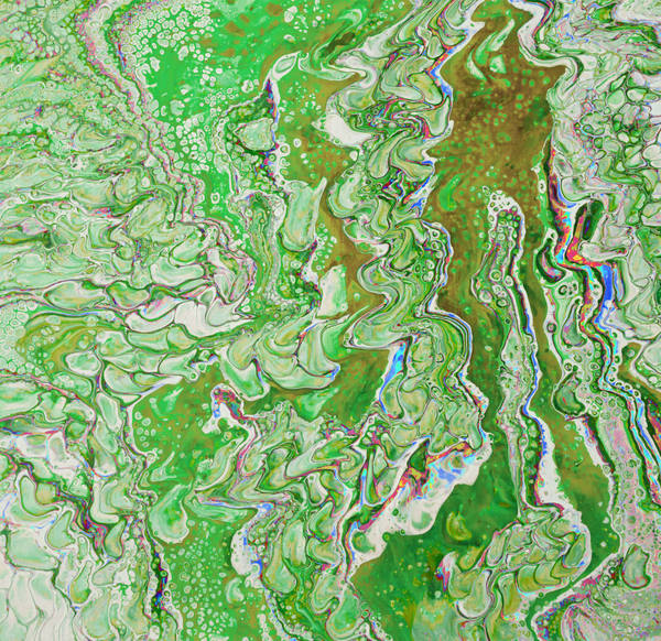 Acrylic pour of grass green and olive rippling over white in tight vertical waves, flecked with red and blue