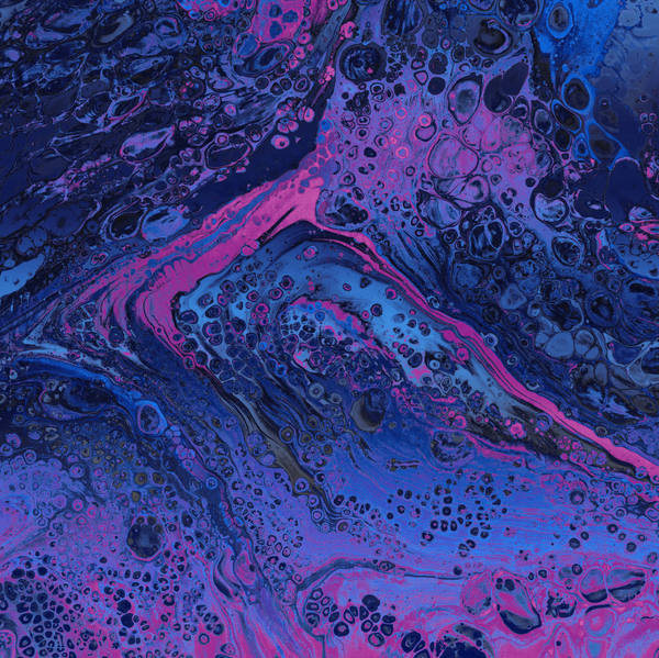 Acrylic pour of indigo and magenta over near-black, dense with small round cells like a night sea