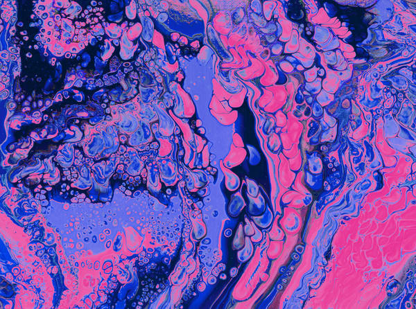 Acrylic pour of hot magenta and electric cobalt splitting across near-black, cells breaking open along the seams