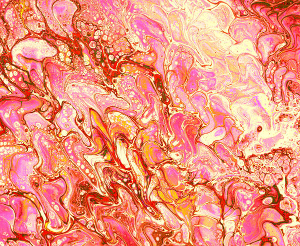 Acrylic pour of coral, rust and pink flowing over cream, lit like clouds at the end of a sunset