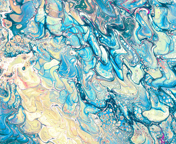Acrylic pour of cobalt and sky blue folding over sand and cream, stacked in layers like a cross-section of water