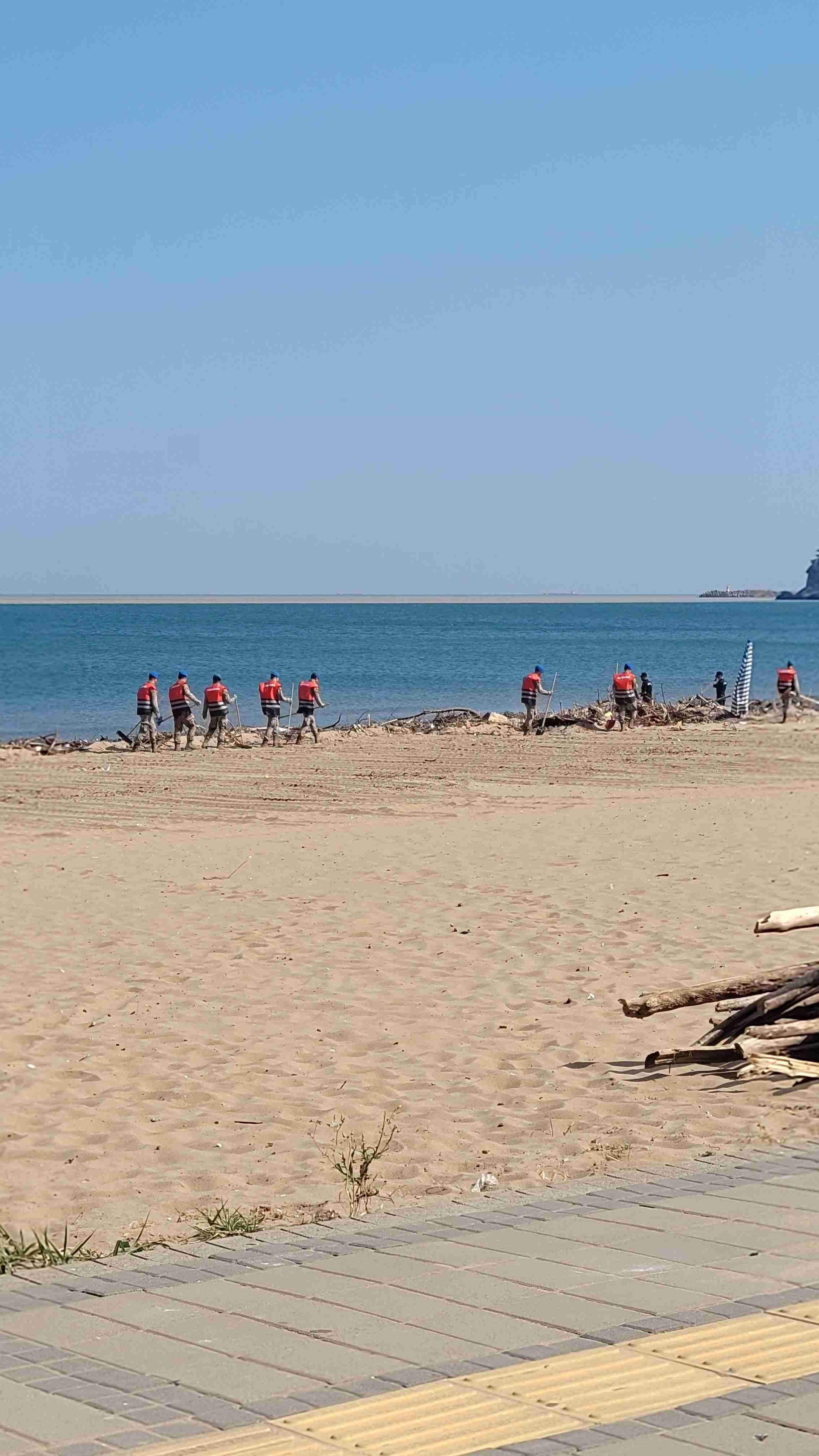 Soldiers cleaning debris after flood in Inkum beach, Bartın