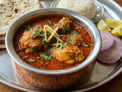 Chicken tomato rassa  - Mains dish from EZGatherr catering menu