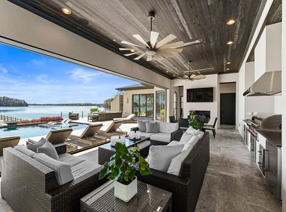 Architectural Marvel with Stunning Shoreline and Sandy Beach