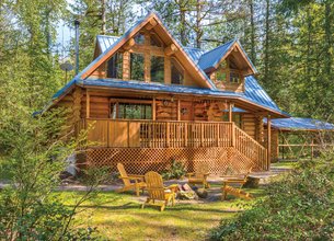 BEAUTIFUL HANDCRAFTED CUSTOM LOG HOME ALONG THE SANDY RIVER