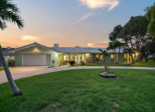 Waterfront Residence Nestled Within The Desirable Harbor Hills Community