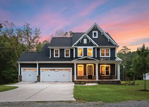 Custom-Built Modern Home Quietly Nestled on .72 Waterfront Acres