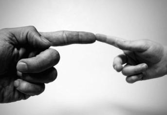 Adult and child pointing to eachother
